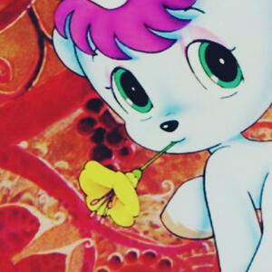 The character Unico from the series of the same name. He is a small white unicorn with pink hair. In this image he has a demure expression gazing at the viewer. He holds a small yellow flower in his mouth.